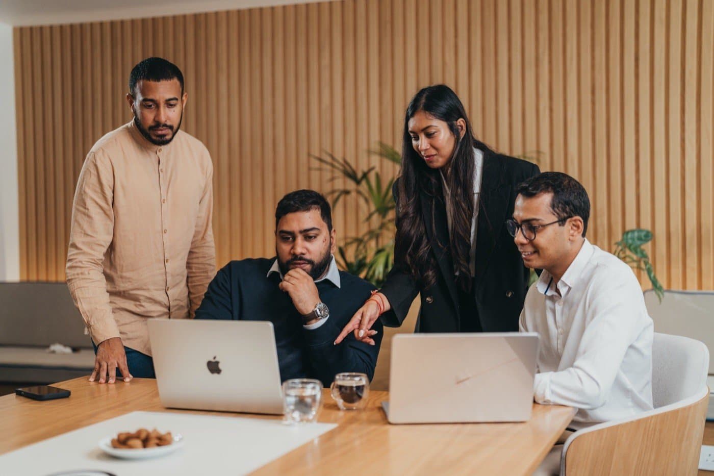 The Lean Search and Lean Tech team working together around one desk